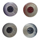 Four plastic buttons with different colors on a white background