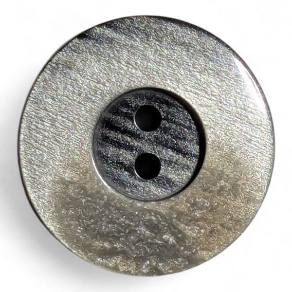 Round brown button with two holes on a white background